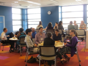 DSSG fellows and staff chat over lunch in the WRF Data Science Studio. Photo, Robin Brooks, eScience Institute