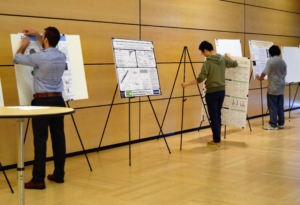 Fellows put their posters up on easels. Photo, Robin Brooks, eScience Institute