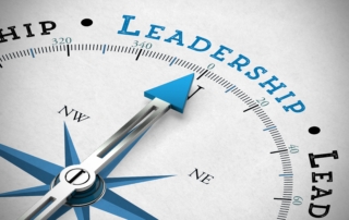 A graphic of a compass pointing at the word leadership.