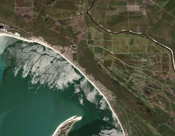 A satellite image depicting land and water