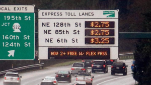 I photo of I-405 that shows the pricing of express toll lanes with cars underneath. AP photo/Elaine Thompson