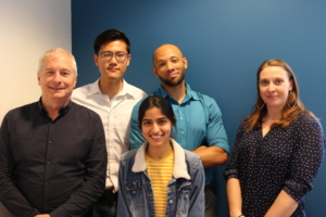 From left to right, Rick Mohler, Yuanhao Niu, Anagha Uppal, Adrian Mikelangelo Tullock, and Emily A. Finchum-Mason. Photo by Robin Brooks, eScience Institute