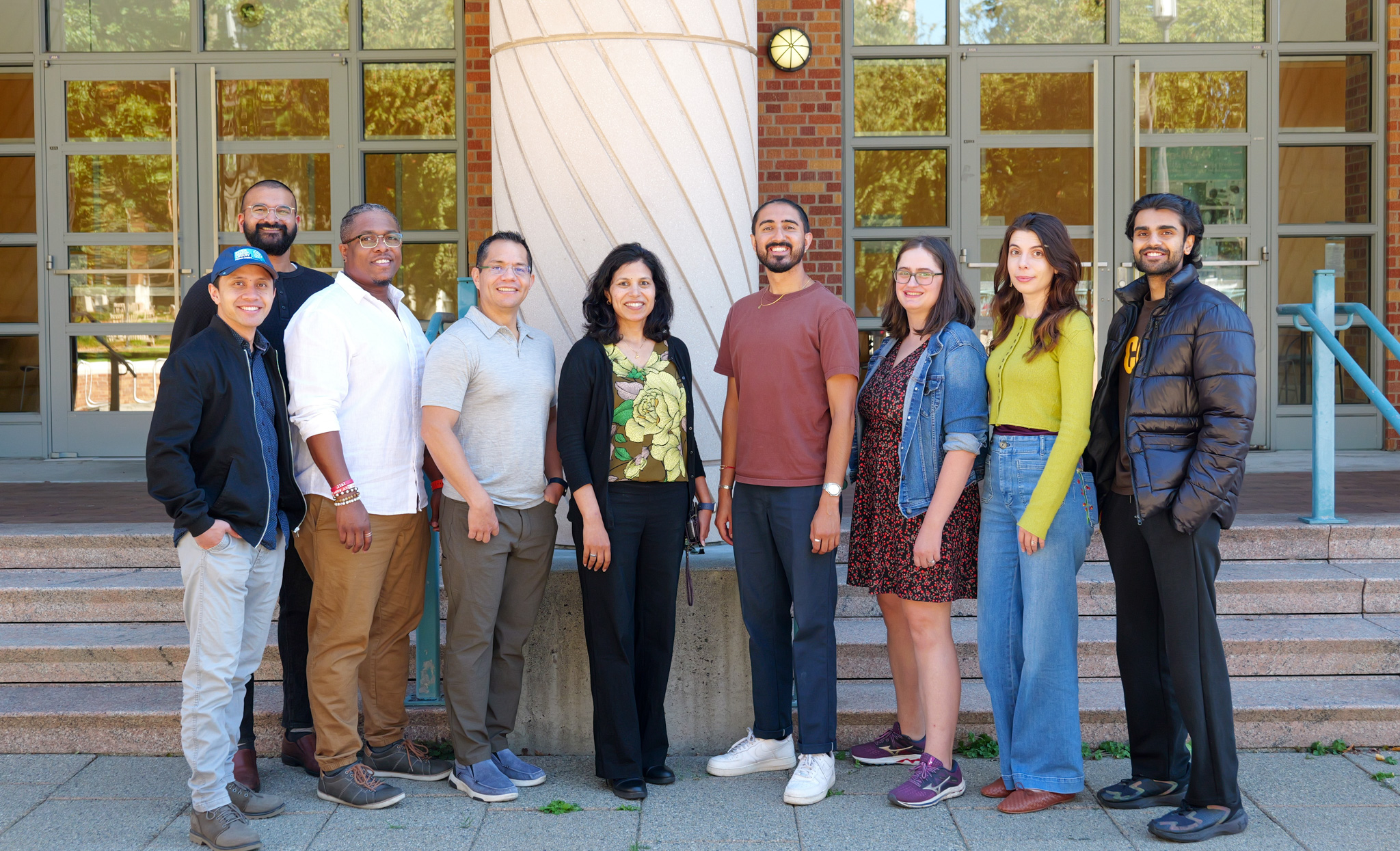 Members of the SSEC team standing next to one another.