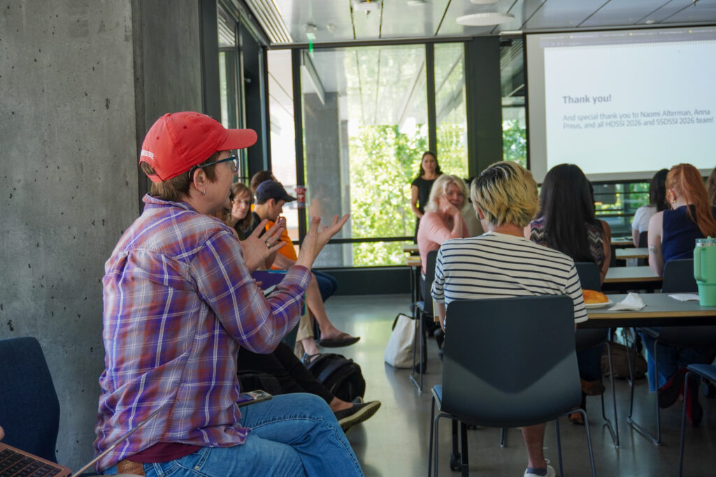 A person speaks to a group of people